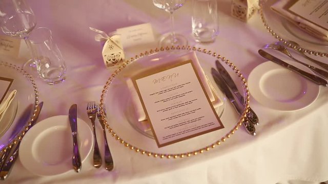Plates at the wedding banquet. Table setting. Wedding decorations. Wedding at the sea in Montenegro.