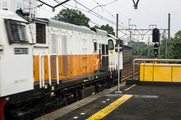 A locomotive passing by railway near the train station photo taken in Jakarta Indonesia