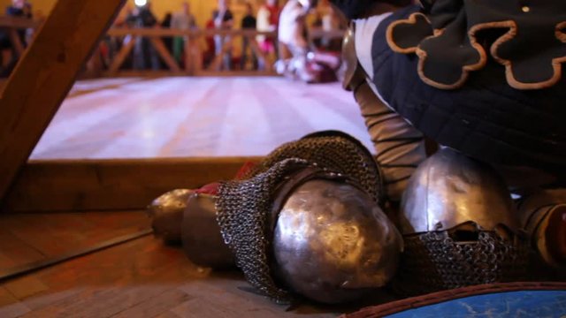 Armor and helmet at Fighting of knights - iron chain armour near arena
