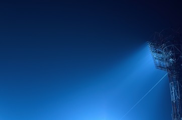 Stadium floodlights against a dark night sky background