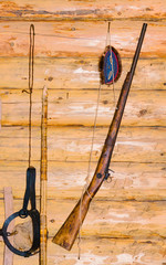 A journey into Siberia, Russia. Hunting gear at the Finno-Ugric peoples Khanty and Mansi, hanging on the wall of a wooden house