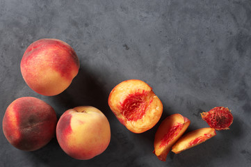 Fototapeta na wymiar Peaches on gray