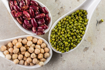 mix of beans on wooden table