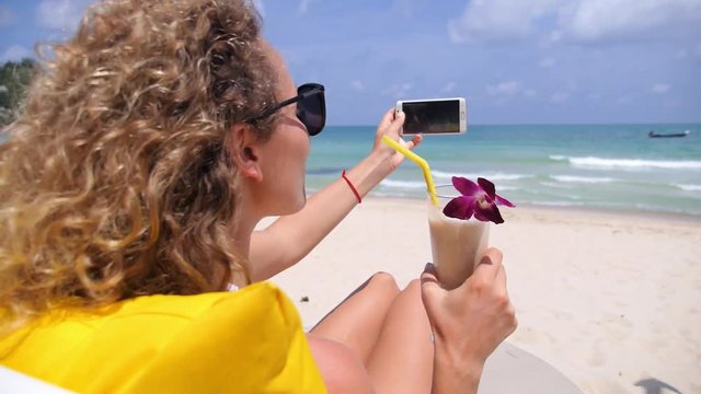 Girl Taking Selfie by Mobile Phone on Beach Vacation.