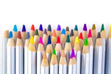 set of different colored pencils on white background