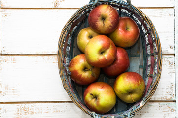 Basket of apples, fresh fruits on market table