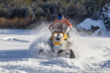 Athlete on a snowmobile