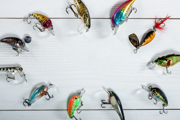 Fishing accessories on a wooden background. © Alex Ishchenko