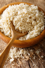 Crispy breadcrumbs Panko for breading in a bowl macro. Vertical
