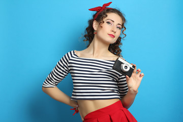  woman with retro camera, wearing pin-up style