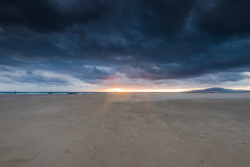 Cloudscape over beach and ocean in Spain, before storm