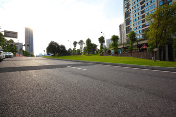 Empty road surface floor with City streetscape buildings