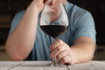 Man Drinking Red Wine on kitchen