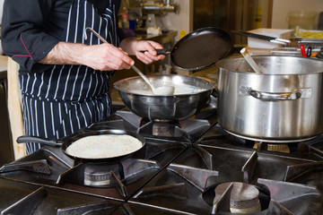 chef cooking omelette in a restaurant