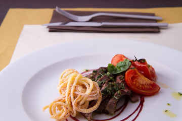 sliced beef served with home made pasta and tomato