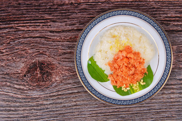 Sticky rice in coconut milk with stir-fried grated coconut and shrimp