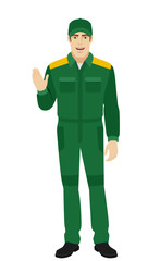 Worker greeting someone with his hand raised up