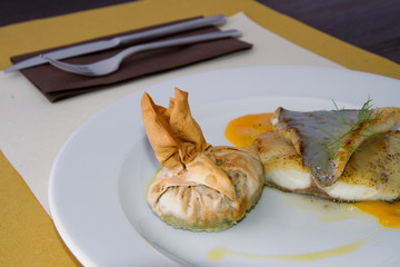 codfish served hot on a plate