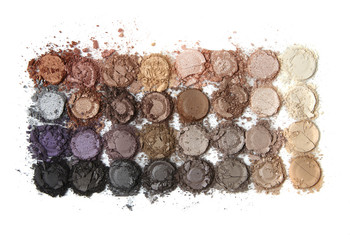 A smashed neutral toned make up palette isolate on a white background