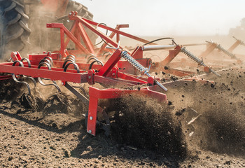 Tractor preparing land