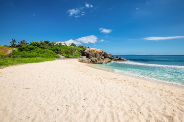 Sunny day on Anse Nord D'Est beach in the north of Mahe Island, Seychelles