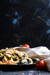 Hot pasta with seafood and tomato sauce, selective focus