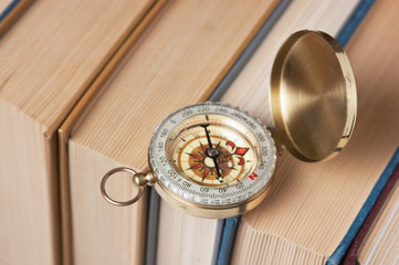 compass and old books