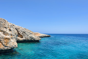 Fototapeta premium Pirate bay in protaras paralimni, immaculate water, blue sea and rocks, cyprus island