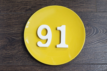 The number ninety one on the yellow plate.