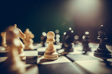 Fototapeta White and black pieces on chess board obraz