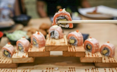 eating sushi in restaurant