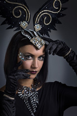  beautiful woman in retro style with ornaments of feathers