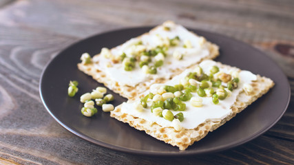 Vegetarian toast smeared with cream cheese, sprouts beans, gluten-free