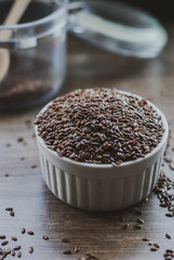Bowl full of brown flaxseed or linseed. Cereals. Vitamins. Healthy food.