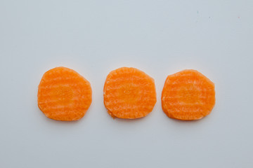 Sliced carrots with waves on a cutting board