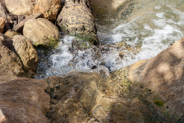 The beginning of a river with clear water in the desert