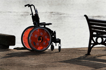 Modern invalid wheel chair without occupant.