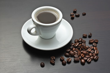 pile of coffee beans and a cup