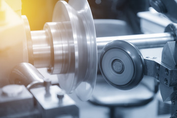 The NC  spinning machine forming the part with light blue scene