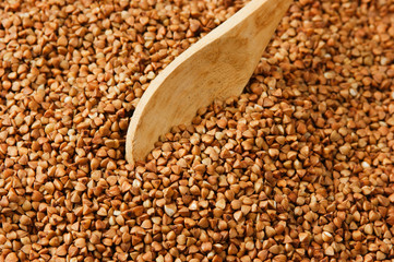 buckwheat groats and wooden spoon