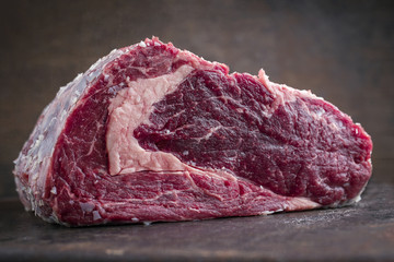 Dry Aged Rib Eye Steak on old Metal Sheet