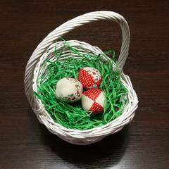 Decorative sewn from rags eggs are in the basket.