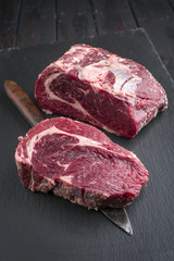 Dry Aged Wagyu Entrecote Steak as close-up on a Slate Slab
