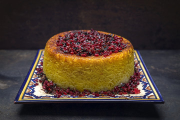 Traditional Iranian rice pie Tahdig Polo with Berberis on a plate