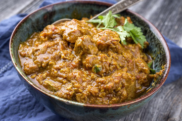 Traditional Indian Lamb Curry as close-up in a bowl