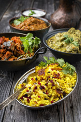 Traditional Indian Iranian Curries with Tahdig as close-up in a Korai