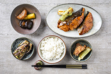 Traditional Japanese dish with Fish Teriyaki and Rice as close-up in bowls