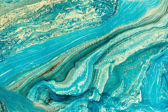 Blue marbling texture. Creative abstract background with  handmade oil painted  surface. Liquid paint.