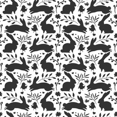 Seamless background with with rabbit silhouette and herb, plant. flower.  Easter wallpaper for invitation and decoration. Cute monochrome backdrop with jumping bunny. Texture for fabric. Vector