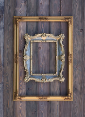 Baroque, gold, old, victorian, empty two frames on a wooden wall